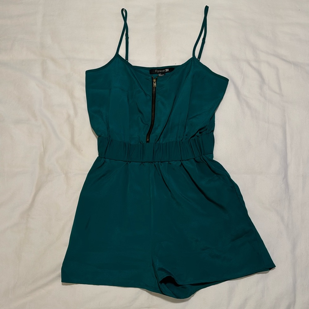 Teal, spaghetti strap romper w/ pockets. Super fun and versatile piece.